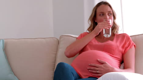 pregnant woman drinking water