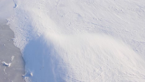 beautiful snowy blizzard, icy river from above view, winter cold, winter landscape.