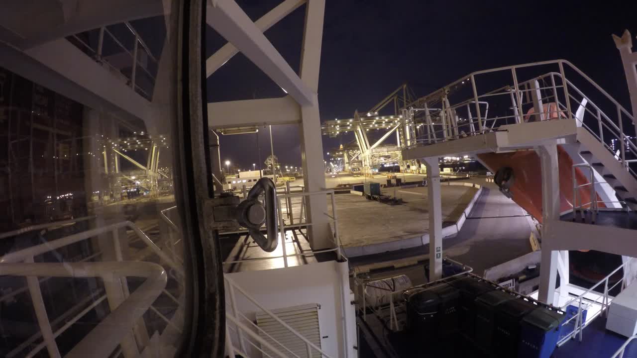 Timelapse of shifting containervessel during dusk and night