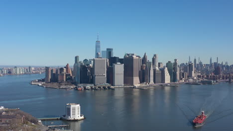 An-aerial-view-of-New-York-harbor-on-a-sunny-day-with-blue-skies