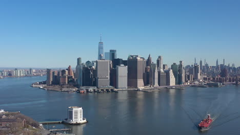 an aerial view of new york harbor on a sunny day with blue skies