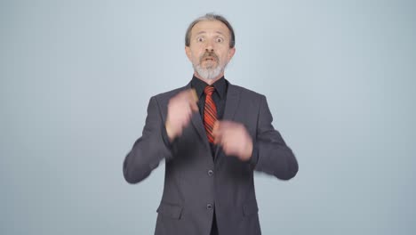 Businessman-giving-motivational-speech-to-camera.