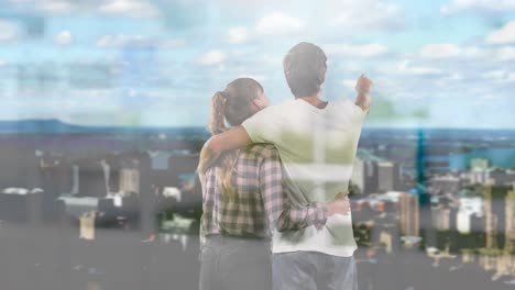 animación de ventanas sobre una pareja abrazada mirando el paisaje urbano
