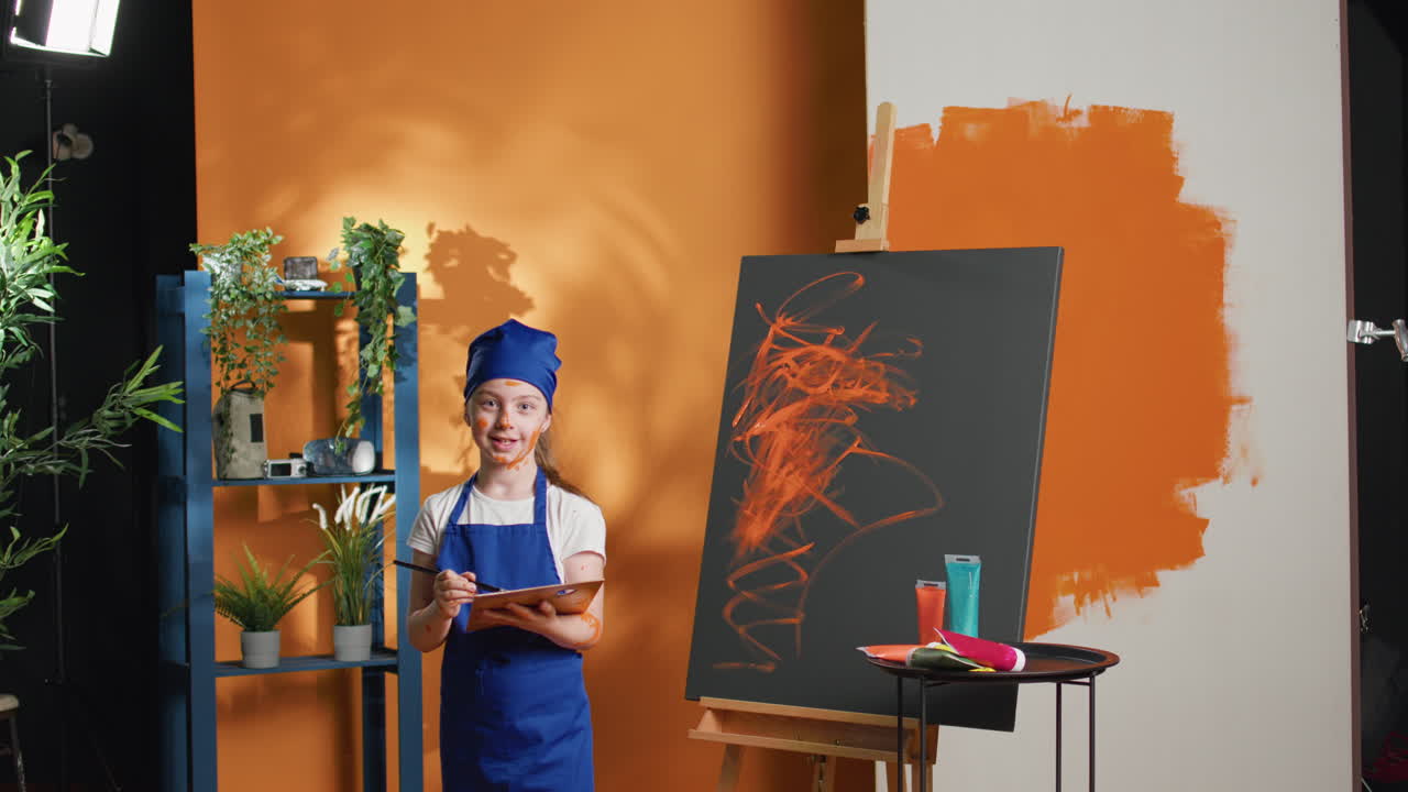 Young Artist Painting in Studio