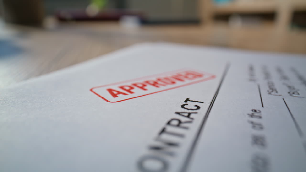Lawyer hand stamping business deal on desk macro closeup. Unknown businessman