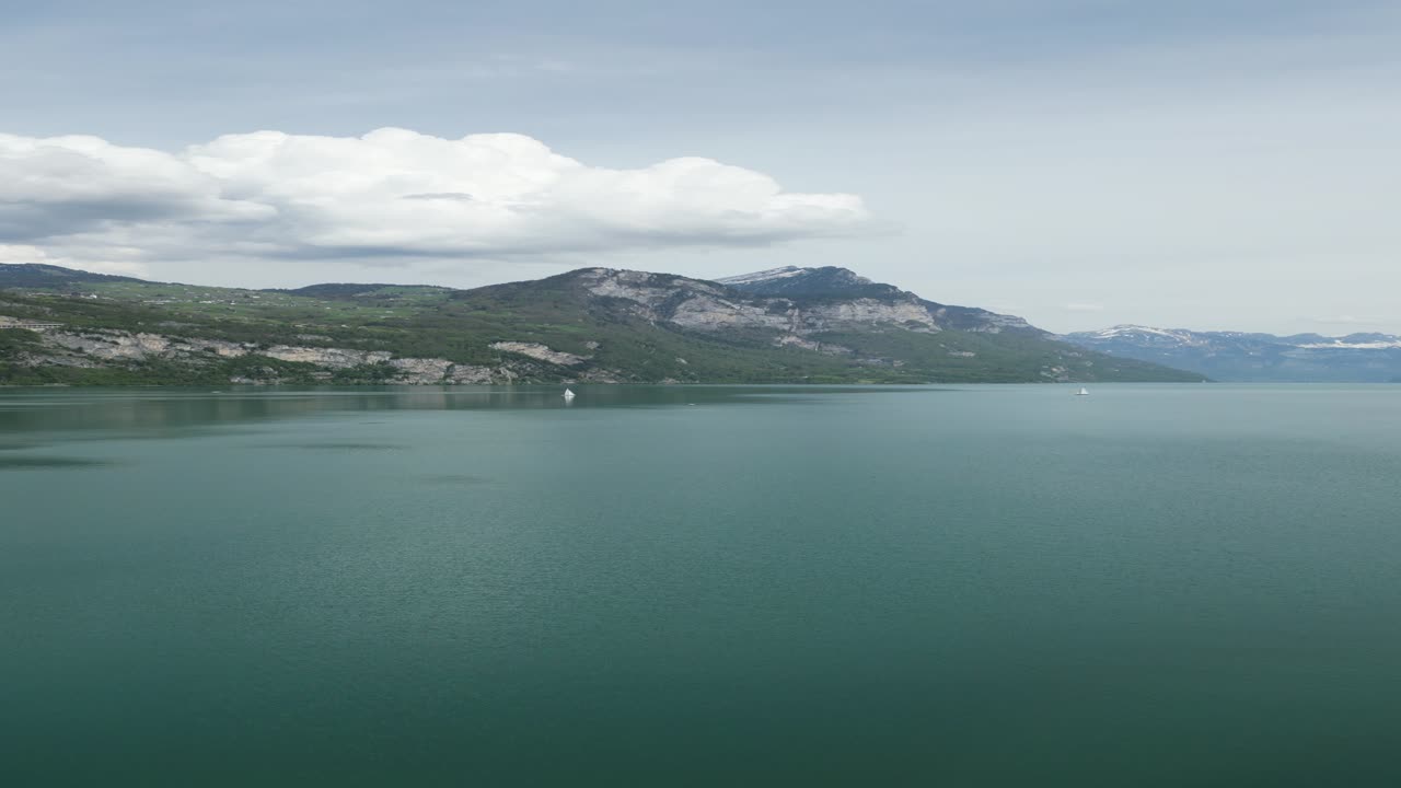 Lake water basin in front of a small village in G&auml;si Betlis, Walensee Glarus, Weesen Walenstadt, Switzerland- drone aerial