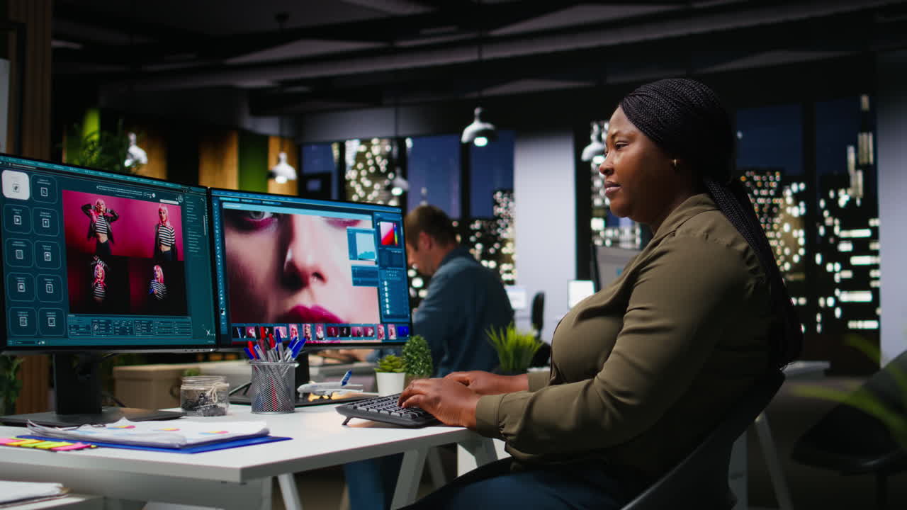 Black photo editor working with retouching software at virtual assistant