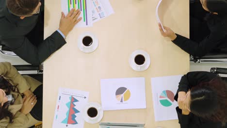 Business-people-group-meeting-shot-from-top-view