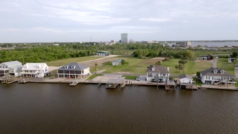 homes along the calcasieu river in lake charles, louisiana with drone video moving forward