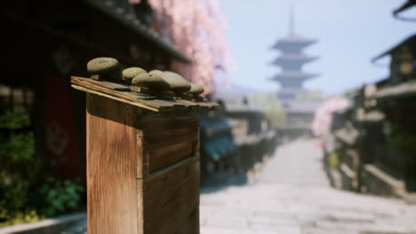 a traditional japanese street with a pagoda in the background