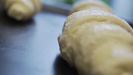 close up from delicious croissant dough ready for the oven