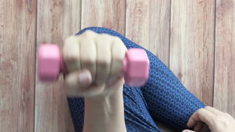 woman doing arm workout with dumbbells