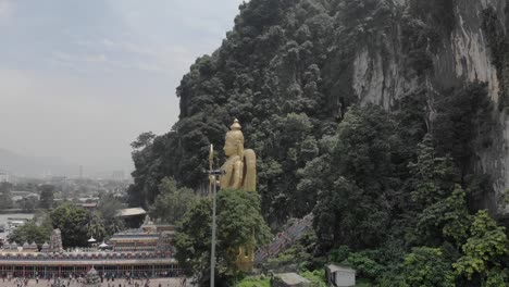 giant golden statue at batu caves, malaysia