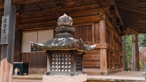 A cinematic shot of a traditional Japanese wooden lamp at a temple in Danjo Garan, Mount Koya, Koyasan, Japan.