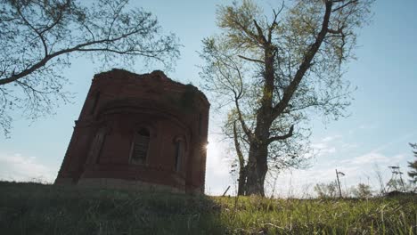 old brick tower ruins in a field