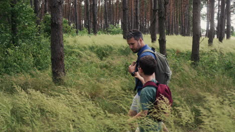 man and children at the forest