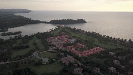 bird's eye view of the lalit golf and spa resort on raj baga beach in canacona, south goa, india - aerial drone shot