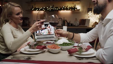 couple talking with friends by video call in christmas time