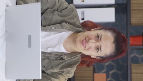 Vertical-video-of-Business-woman-winking-at-camera.