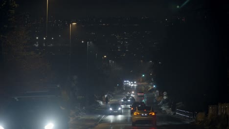 dark and busy street. a rainy winter night. hazy atmosphare.