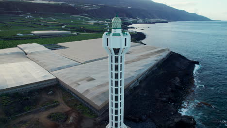 Fantastic-aerial-view-over-the-Las-Hoyas-lighthouse-on-the-Canary-island-of-La-Palma,-near-banana-trees-and-the-coast