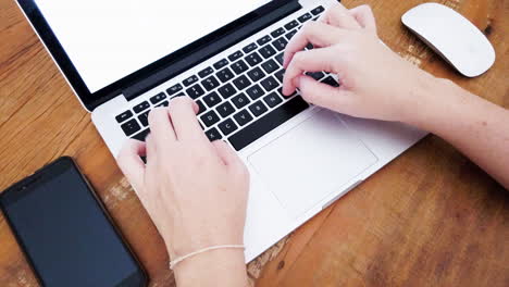 person typing on notebook keyboard