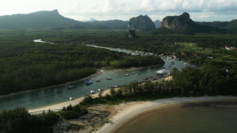 Thailand-tourist-boat-harbor-in-Son-river,-drone-view