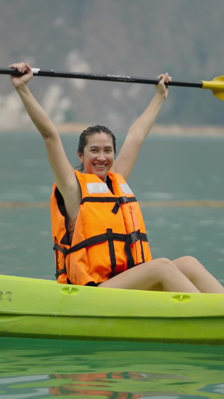Woman kayaking on a lake