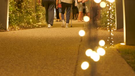 low-angle-of-people-walking-during-Christmas-season