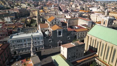 forward drone shot above church of gesu nuovo in napoli, italy on typical day