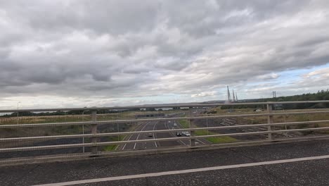 a scenic drive over a scottish bridge