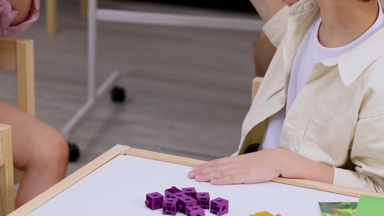 Child learning math with blocks