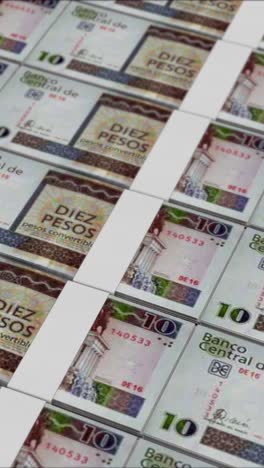 vertical video of 10 cuban peso banknotes printed by a money press