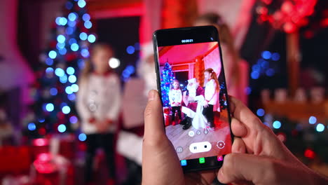 taking photo during christmas. close up of taking photos with santa claus