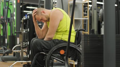 man with disabilities training in the gym of rehabilitation center