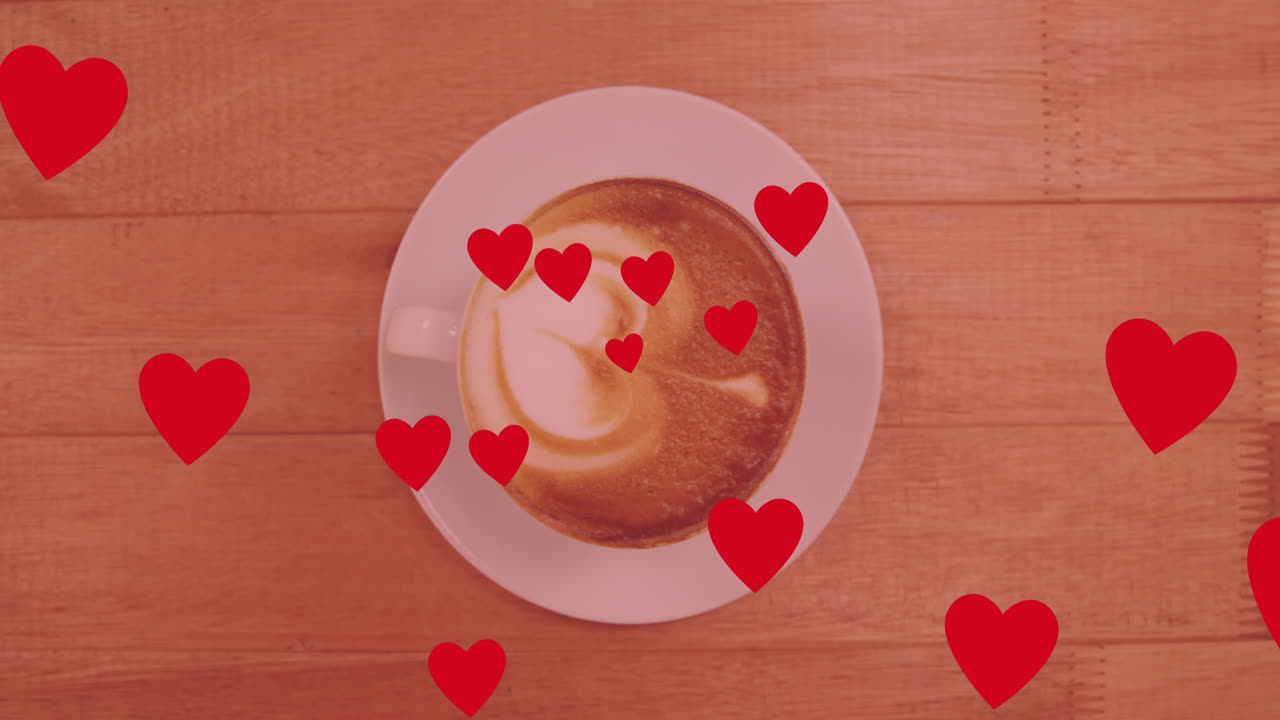 animación de corazones sobre una taza de café
