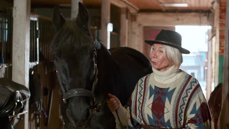 jockey and her animal at the stables