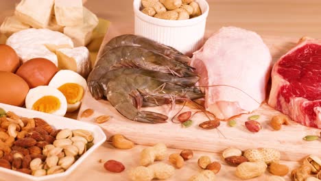 variety of meats, nuts, and seafood arranged together