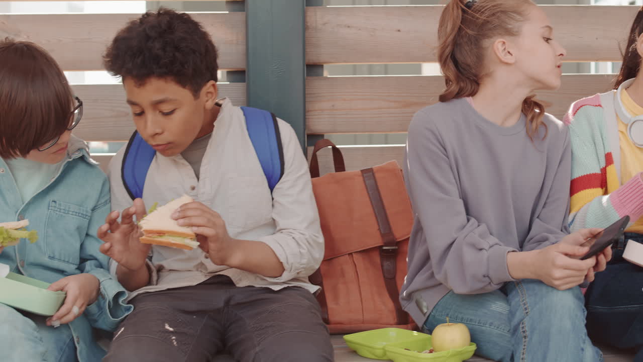 School Children Having Lunch Outdoors