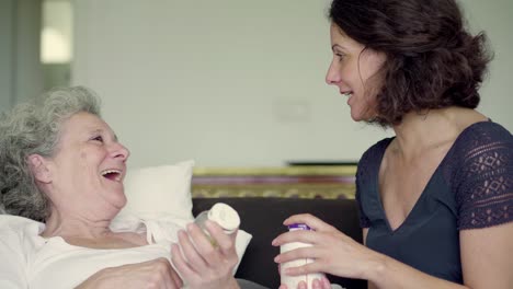 Two-smiling-women-with-plastic-bottles.