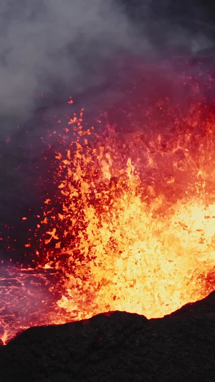 Aerial close up of the bright lava flowing out of the eruptive fissure, Sundhnukkar volcano
