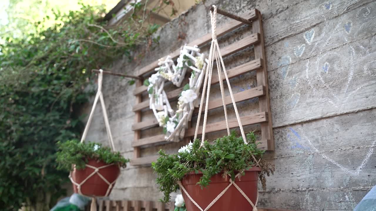 Heart-shaped decoration made of natural materials in a serene outdoor garden setting, surrounded by greenery