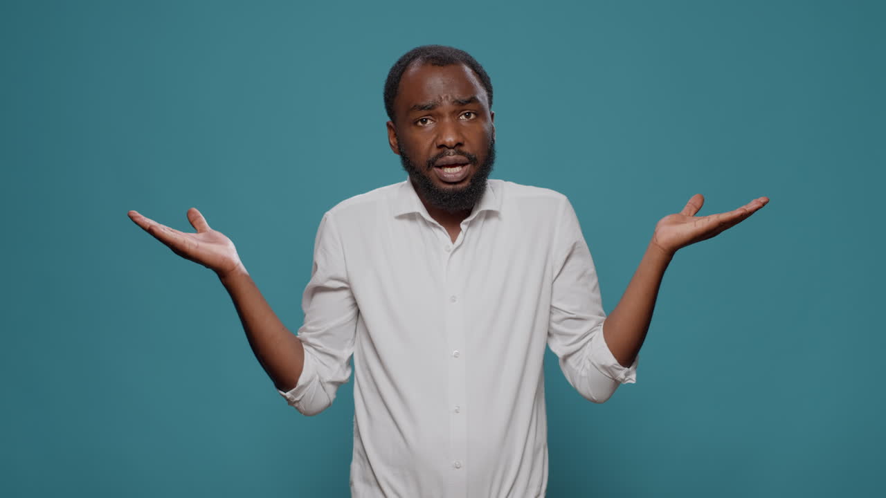 Confused African American Man Shrugging