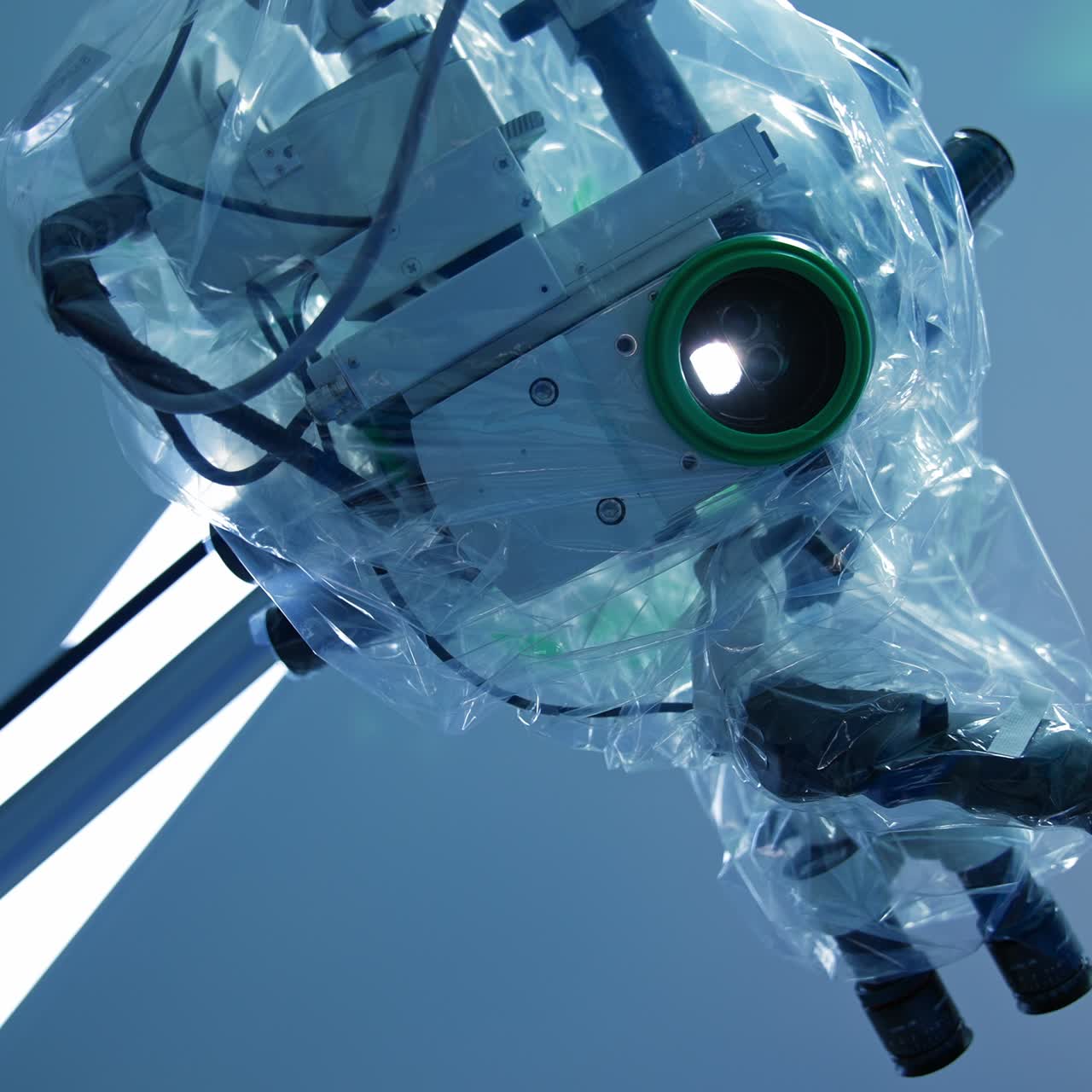 Equipment coated with plastic and ready for surgical operation. Footage of microscope from patient's perspective