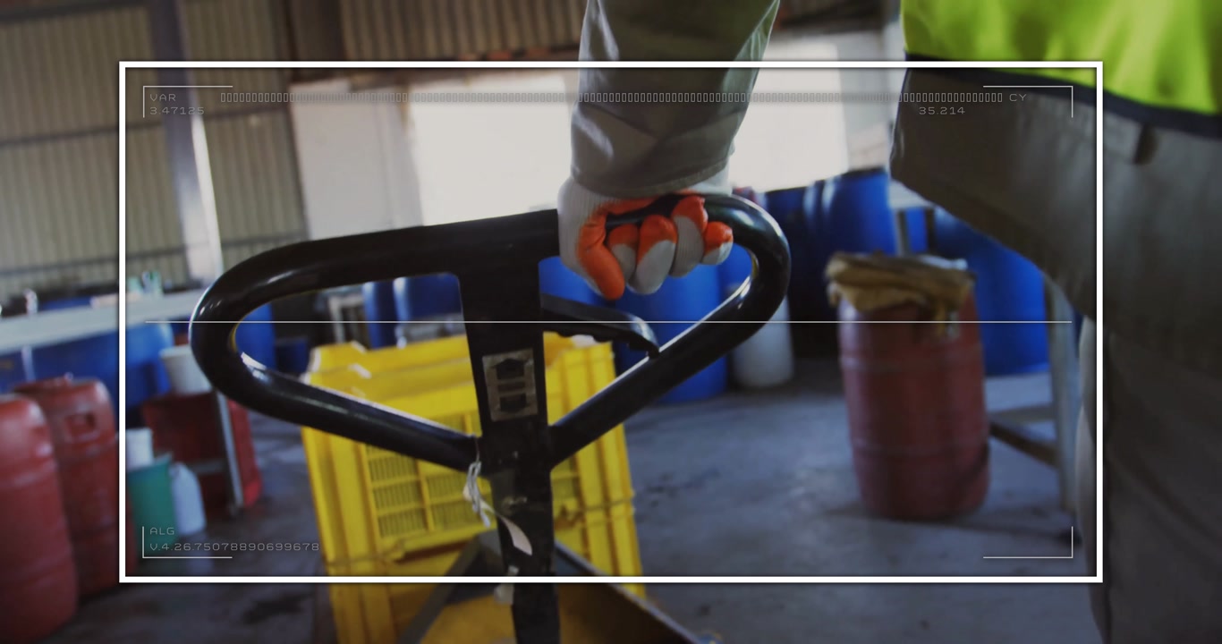 Female warehouse worker gripping pallet jack activating grid and bars showing metrics