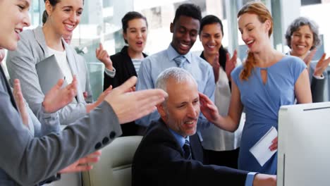 Group-of-Business-people-appreciating-their-colleagues-works