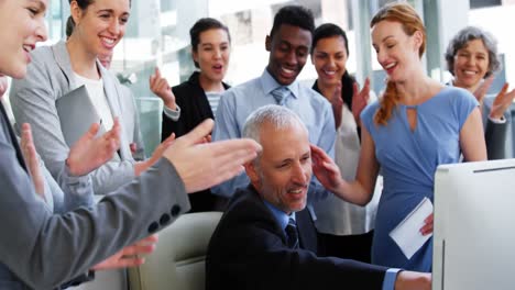 group of business people appreciating their colleagues works