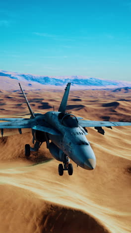 fighter jet flying low over desert dunes