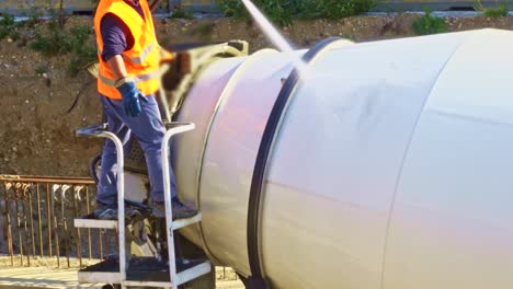 worker over the concrete mixing machine