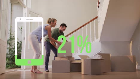 animation of green smartphone and percent over caucasian couple with boxes moving in to new home